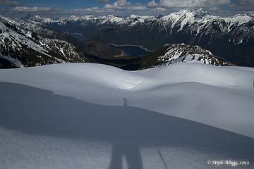 Standing on the buried Sourdough Lookout. Ross Lake below.