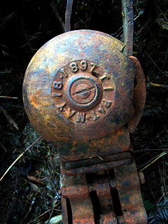 Tram hanger detail 2008.  The circular object is a bell.  Note the date.