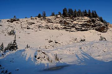 My shadow standing on a frozen tarn near camp.