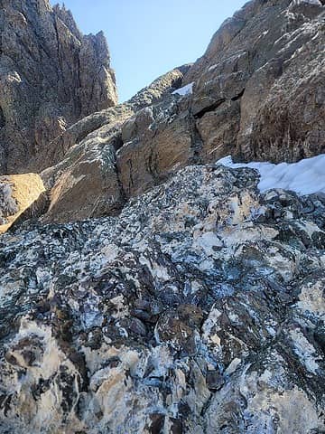 rock traversing to above the col. [b:dbf00f2b7a]Any thoughts about the white stuff on the rocks?[/b:dbf00f2b7a] My thought was salt deposits (once undersea?) but was confident enough to do a taste test...