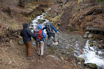 Hikers try to keep there feet dry while crossing McCrea Creek, West Fork Rapid River Trail, Idaho.