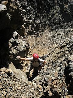 Eric climbing past a chockstone in the summit gully