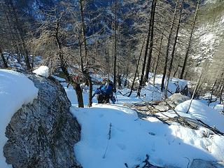 Team climbing up through the burn