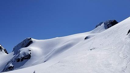 Final snowfield traverse to summit block