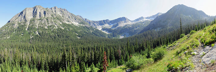 Switchbacking out of the forest with Mosquito Lake basin  center.