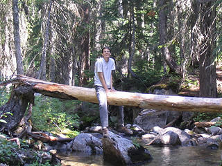 Todd straddles a log