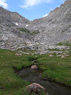 Beautiful alpine basin below Stone Pillar
