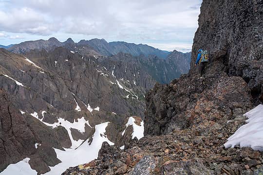 Chris on a ledge, Buckhorn group behind