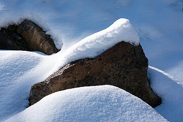 A picture of snow on a rock