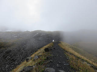 Hogback, an older lateral moraine, looking up toward the western portion of the Coleman Glacier where the Coleman - Deming  climbing route begins. Fog rolling in.