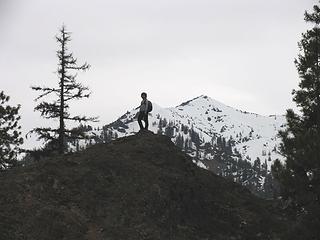 Posing on one of many rock knolls at about 3900 ft, Bean Pk behind.