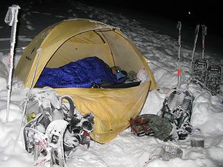 Snowy camp area. Carla tries to stay warm.