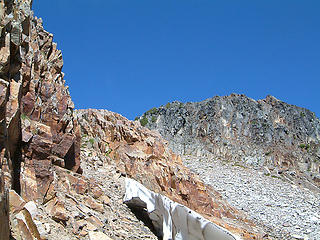 Gothic Peak summit ahead as seen while scrambling through some rock bands.