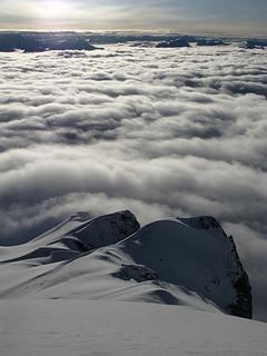 Clouds fill the lower elevations